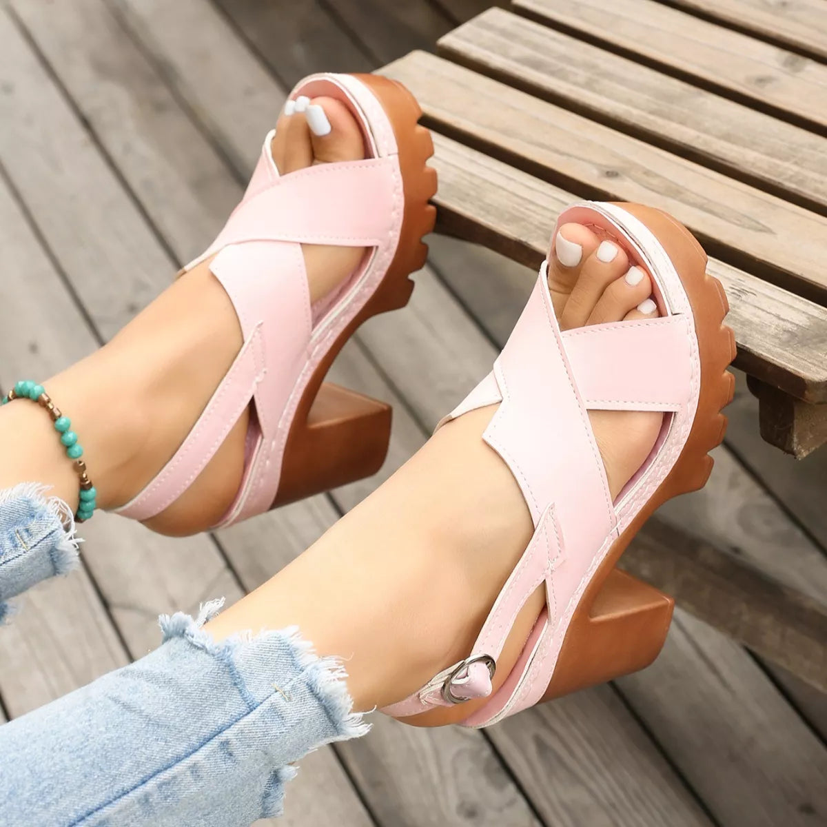 retro chunky platform sandals with crisscross straps and boho-inspired high heel silhouette in pastel tones