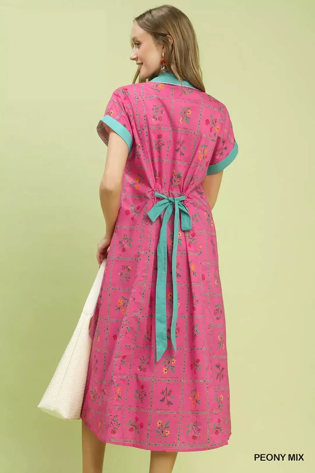 pink floral midi dress with button-front detail and belted waist in a romantic boho style