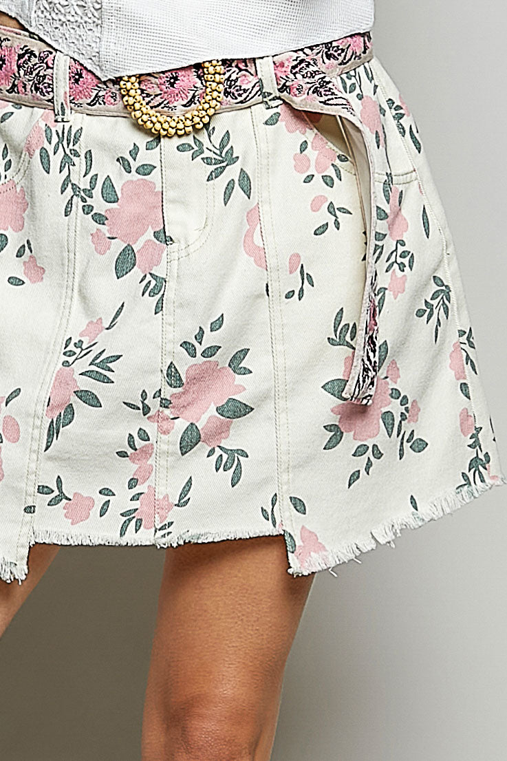 Boutique floral twill A-line mini skirt with raw hem and front pockets