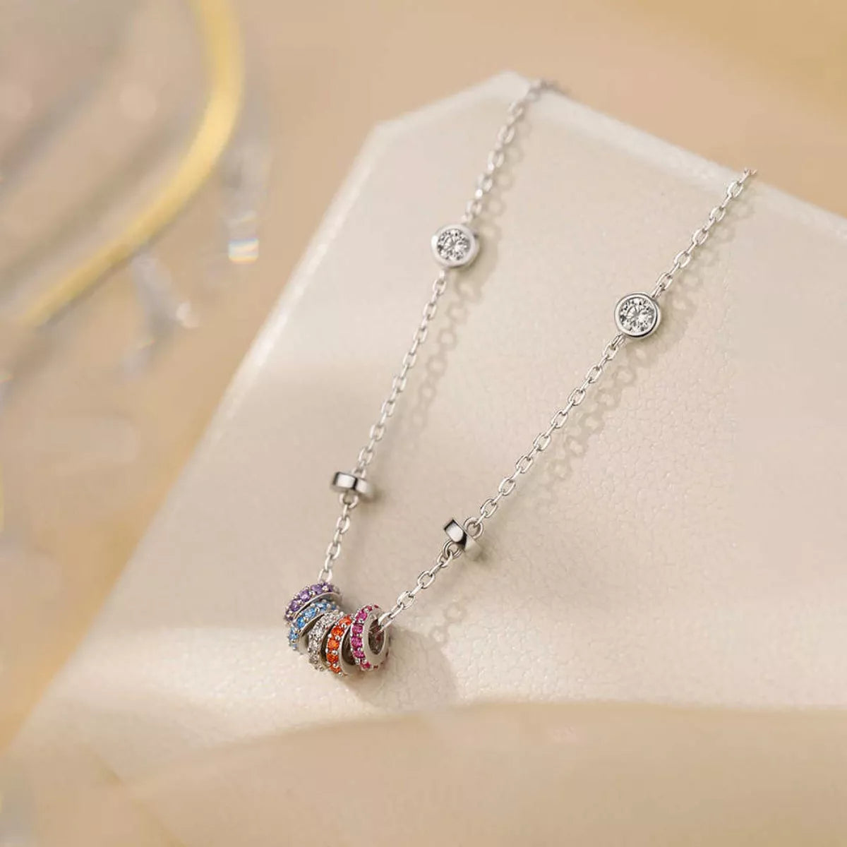 Sterling silver necklace with multicolor zircon ring pendant