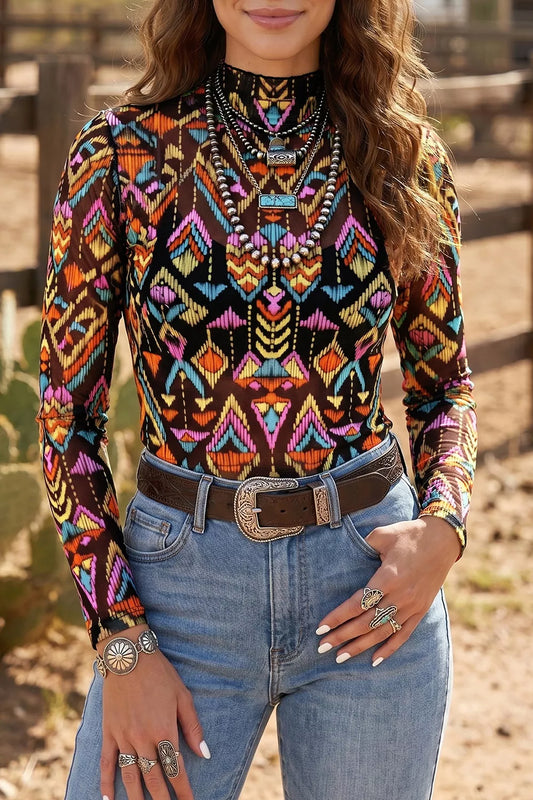 Colorful western-inspired mock neck mesh top with geometric print, long sleeves, and slightly stretchy fit styled with denim and turquoise jewelry.