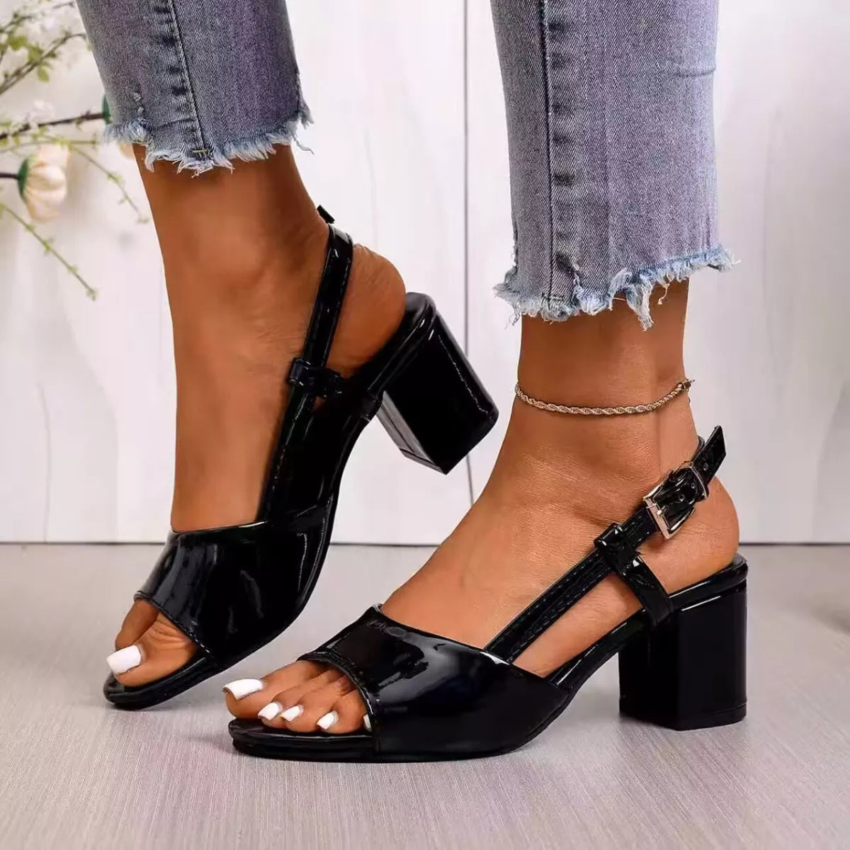 open-toe block heel sandals in rainbow swirl and glossy black styles with ankle straps