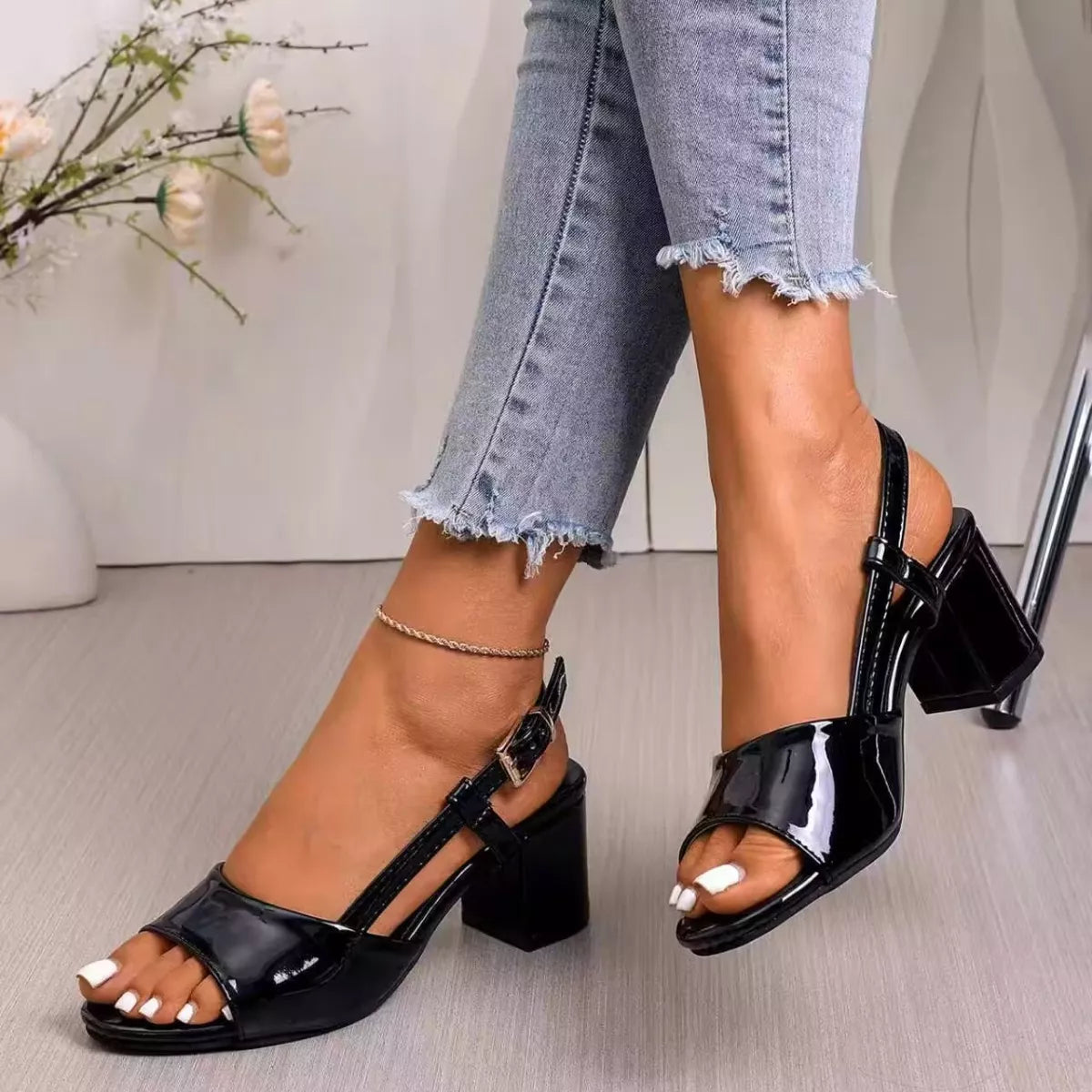 open-toe block heel sandals in rainbow swirl and glossy black styles with ankle straps