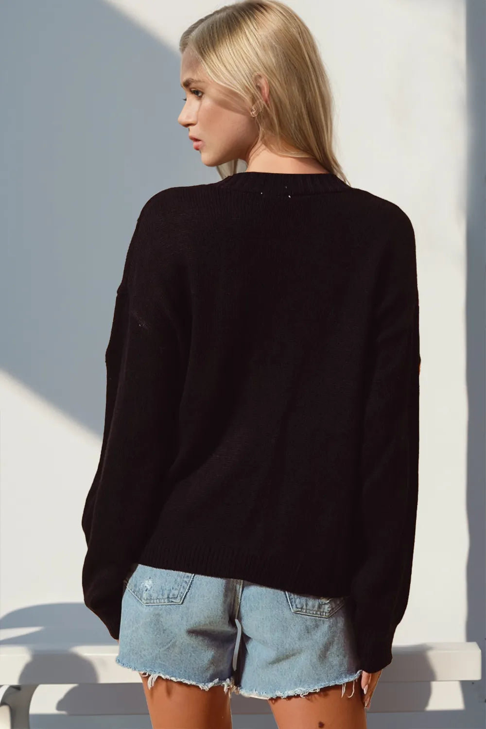 Pumpkin Patch Button Up Cardigan – black button-up sweater with pumpkin appliqués, festive fall knit.