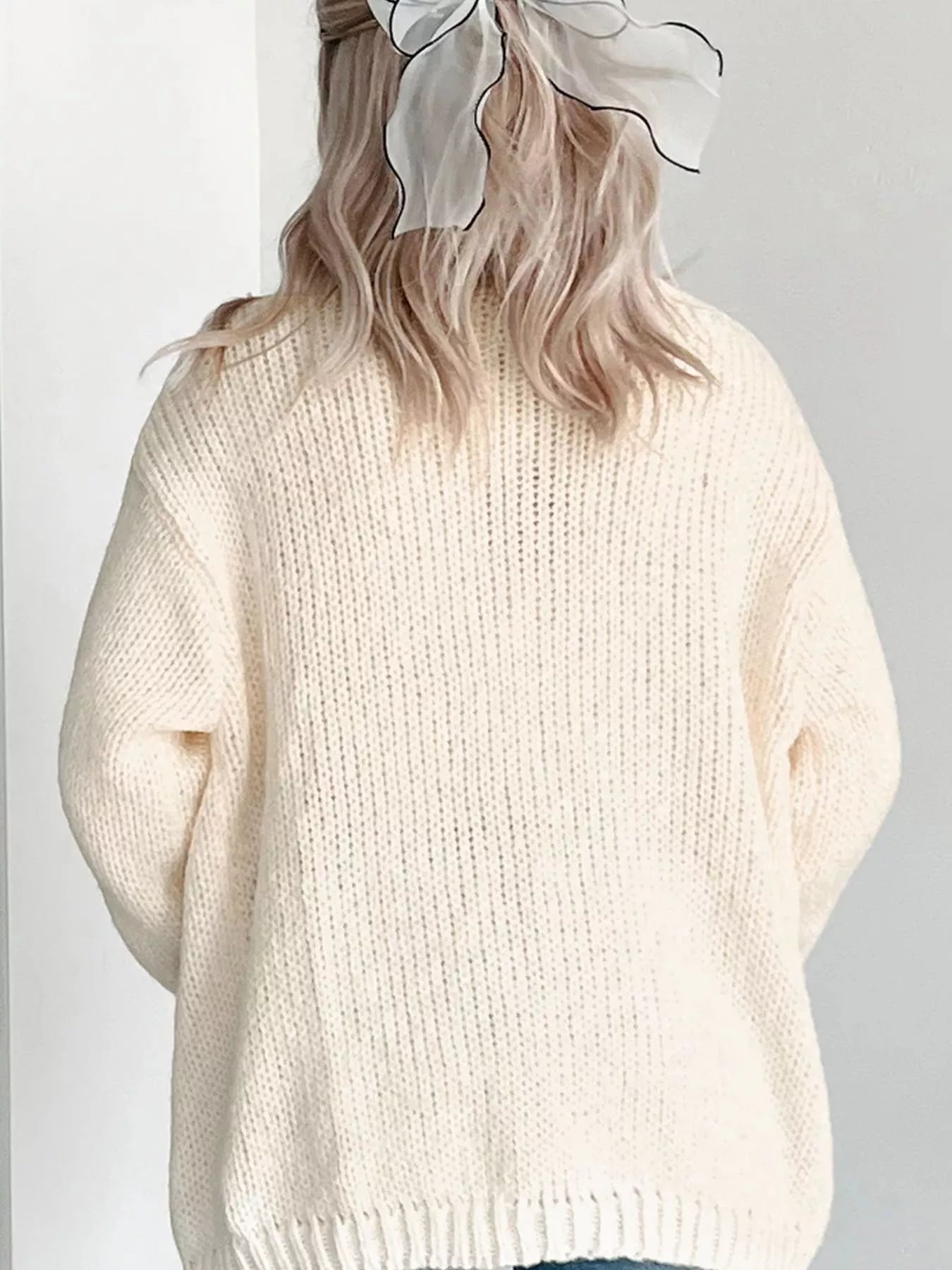 White knit cardigan with orange pumpkin embroidery – Pumpkin Patch style from A Whimsical Affair.