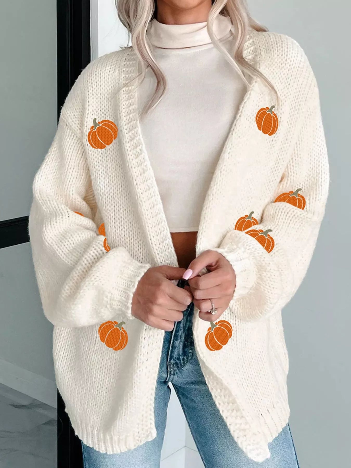 White knit cardigan with orange pumpkin embroidery – Pumpkin Patch style from A Whimsical Affair.