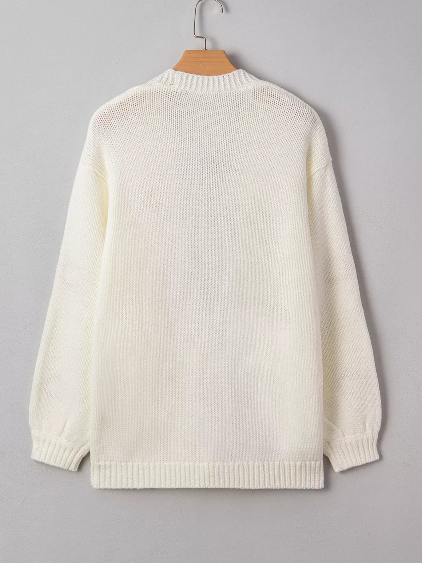 White knit cardigan with orange pumpkin embroidery – Pumpkin Patch style from A Whimsical Affair.