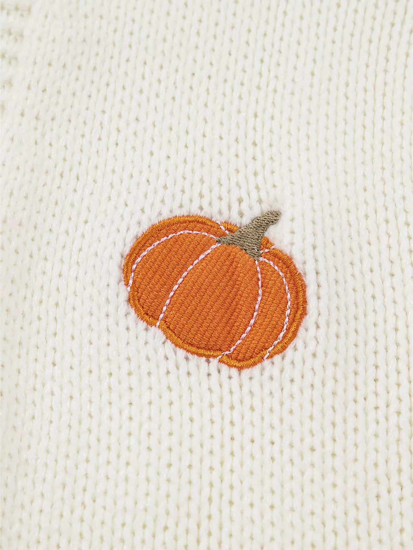 White knit cardigan with orange pumpkin embroidery – Pumpkin Patch style from A Whimsical Affair.