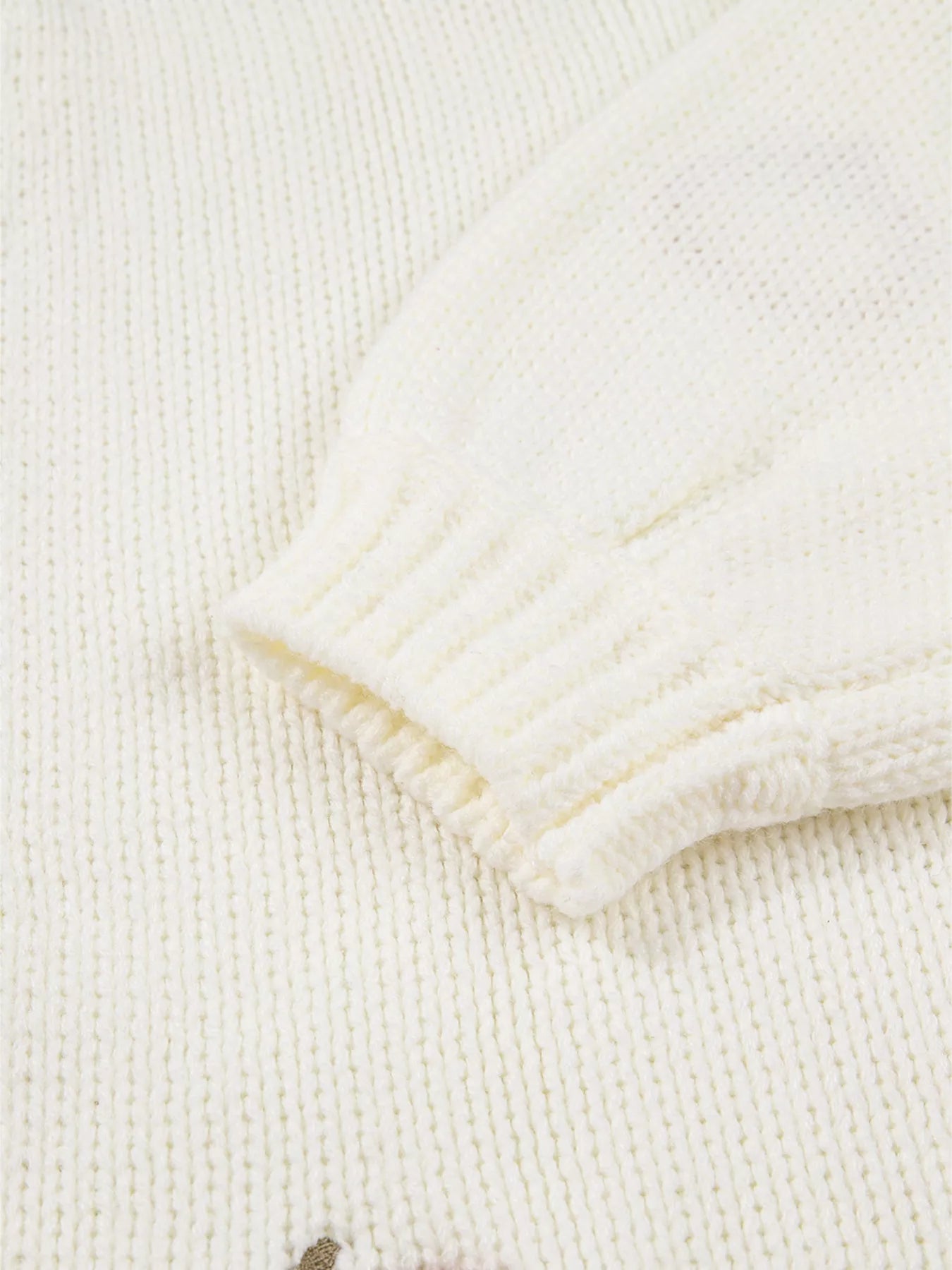 White knit cardigan with orange pumpkin embroidery – Pumpkin Patch style from A Whimsical Affair.