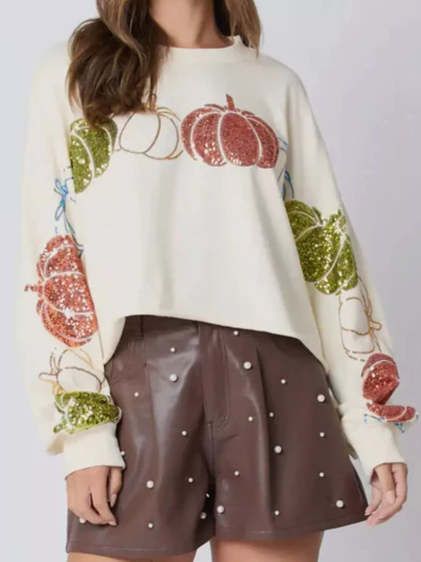 Pumpkin Patch Sparkle Sweatshirt in cream with sequin pumpkins on sleeves – festive autumn top