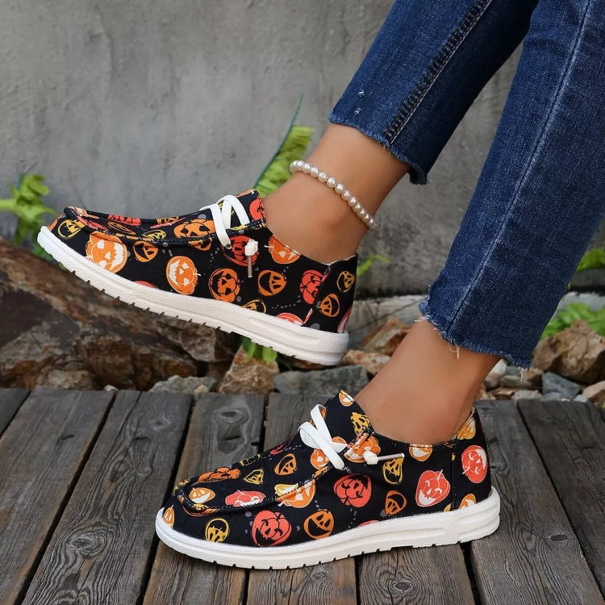 Pumpkin Stompers Sneakers – festive Halloween pumpkin print round toe canvas sneakers with cushioned rubber sole.