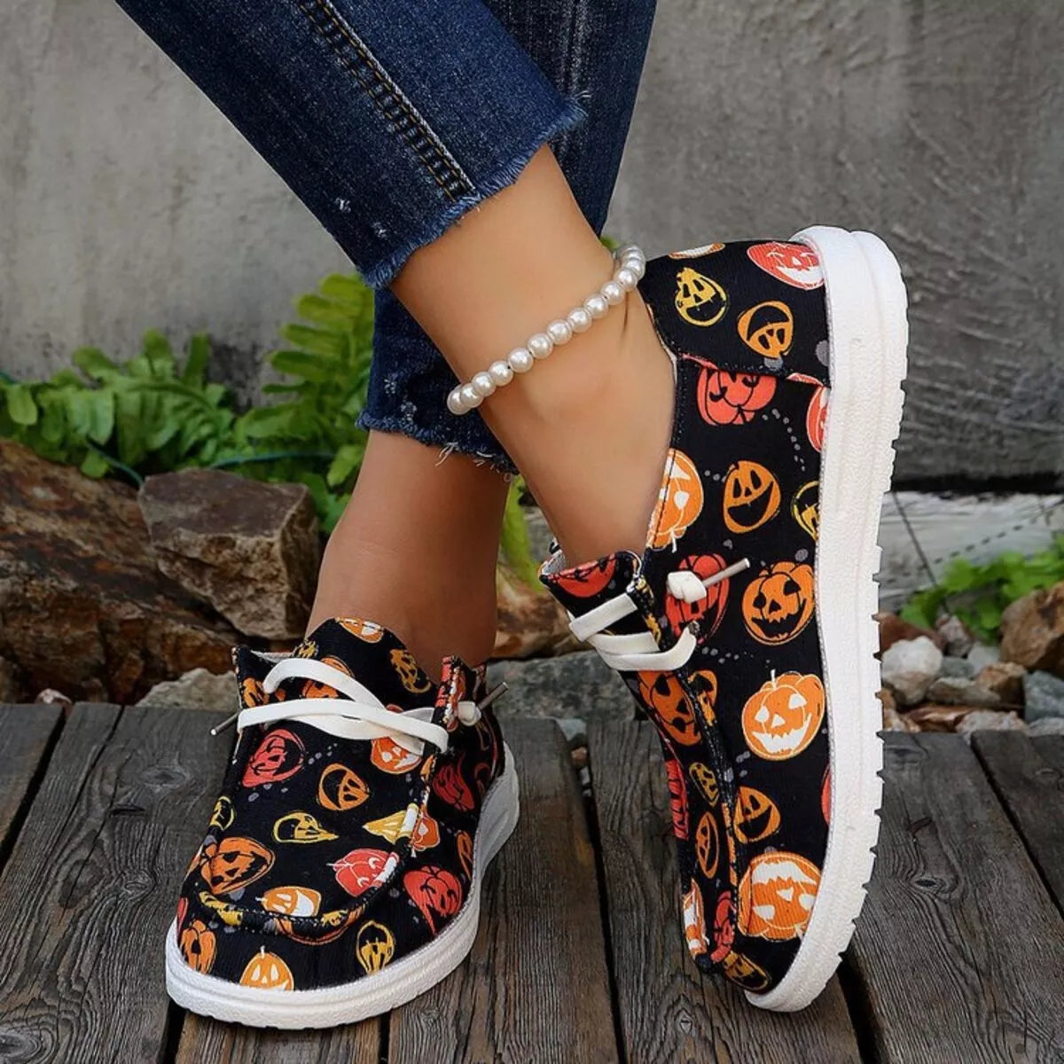 Pumpkin Stompers Sneakers – festive Halloween pumpkin print round toe canvas sneakers with cushioned rubber sole.