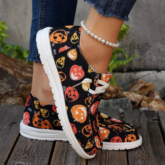 Pumpkin Stompers Sneakers – festive Halloween pumpkin print round toe canvas sneakers with cushioned rubber sole.