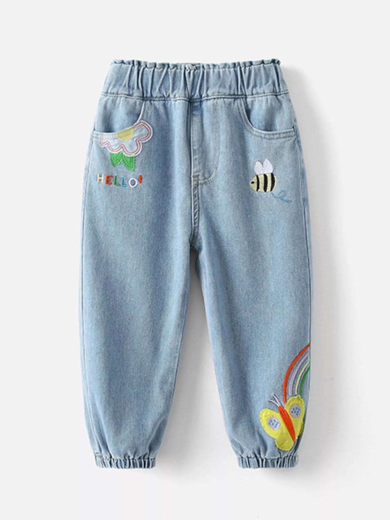 Light-wash kids' denim joggers with embroidered rainbow, bee, and butterfly details. Elastic waist and pockets for comfy, playful style.