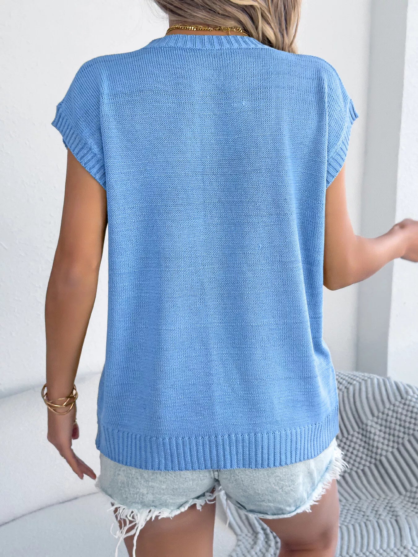 Women’s relaxed fit knit top with colorful floral accents and short sleeves