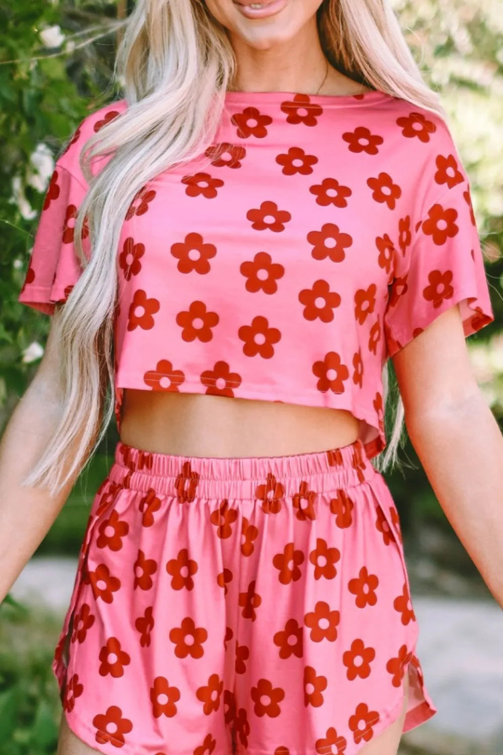 Retro Bloom lounge set in pink with red daisy floral print – cropped tee and shorts two-piece outfit.