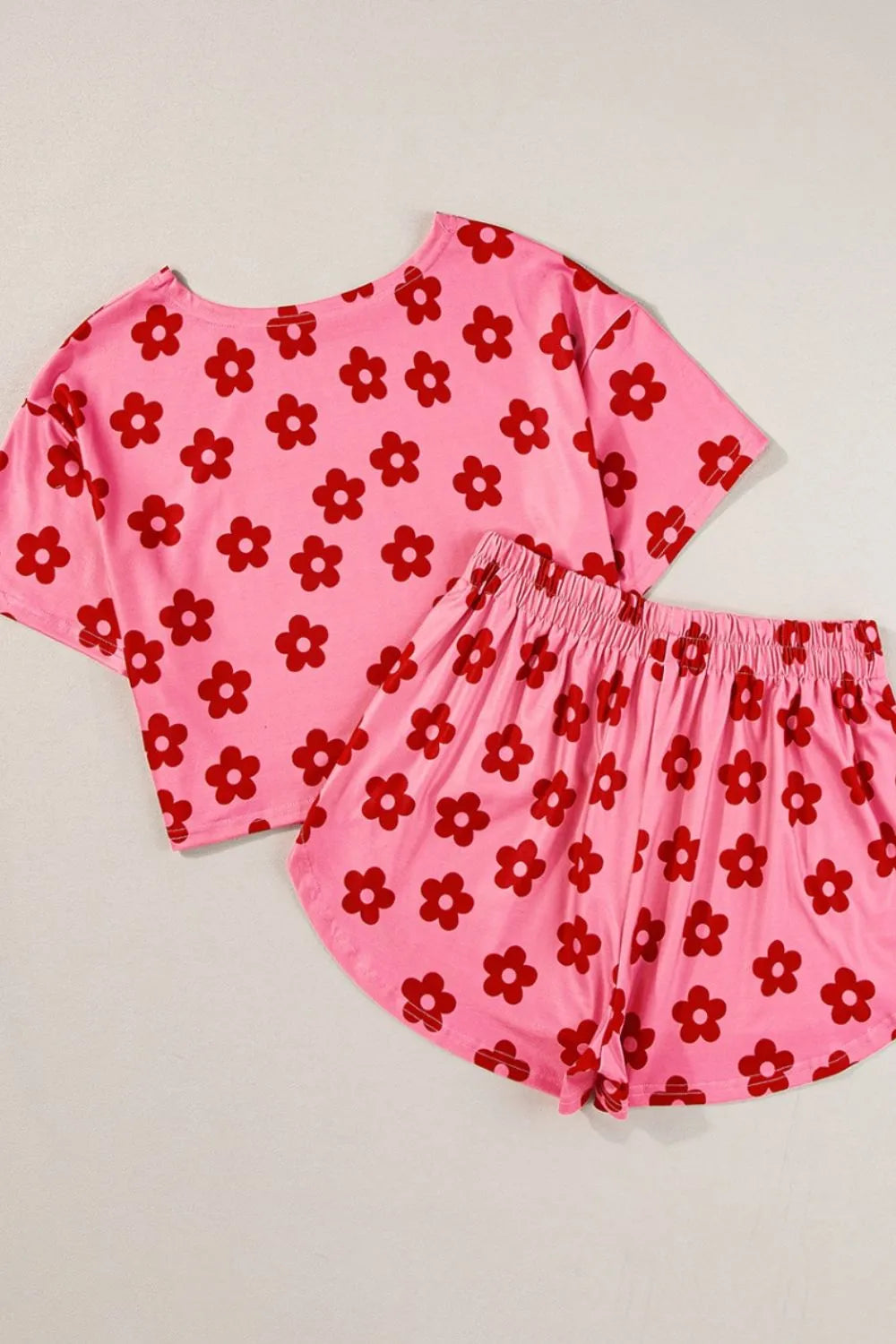 Retro Bloom lounge set in pink with red daisy floral print – cropped tee and shorts two-piece outfit.