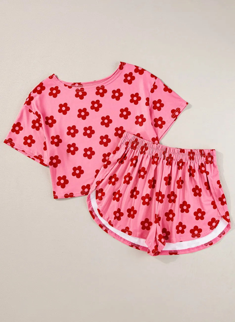 Retro Bloom lounge set in pink with red daisy floral print – cropped tee and shorts two-piece outfit.