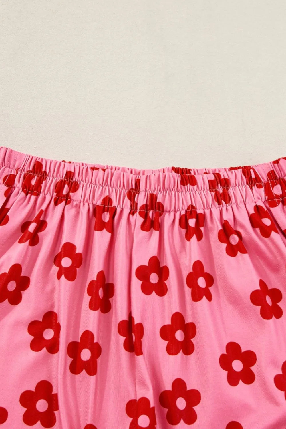 Retro Bloom lounge set in pink with red daisy floral print – cropped tee and shorts two-piece outfit.