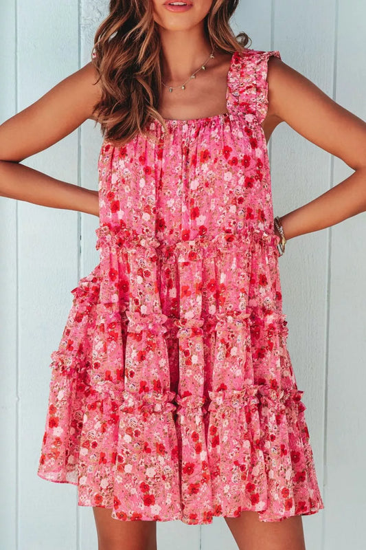 Pink tiered floral mini dress with ruffle detailing and sleeveless design