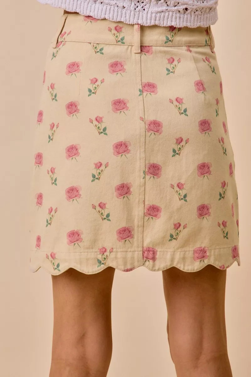 Floral rose print cotton twill mini skirt with scalloped hem and button front closure