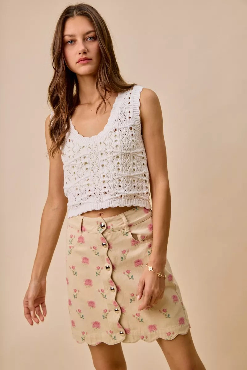 Floral rose print cotton twill mini skirt with scalloped hem and button front closure