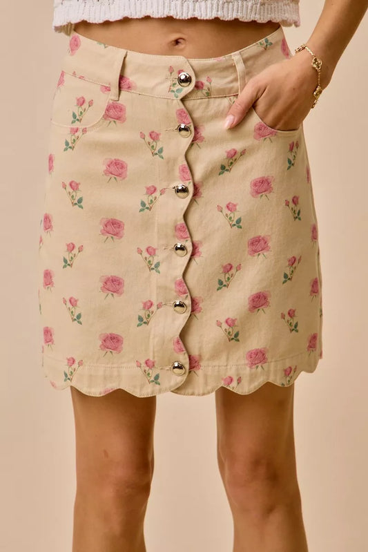 Floral rose print cotton twill mini skirt with scalloped hem and button front closure