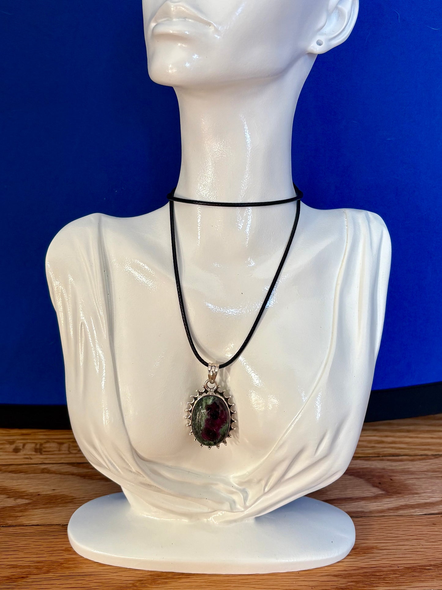 Sterling silver Ruby in Zoisite pendant on black leather cord, featuring green and ruby-toned natural stone with decorative silver edge