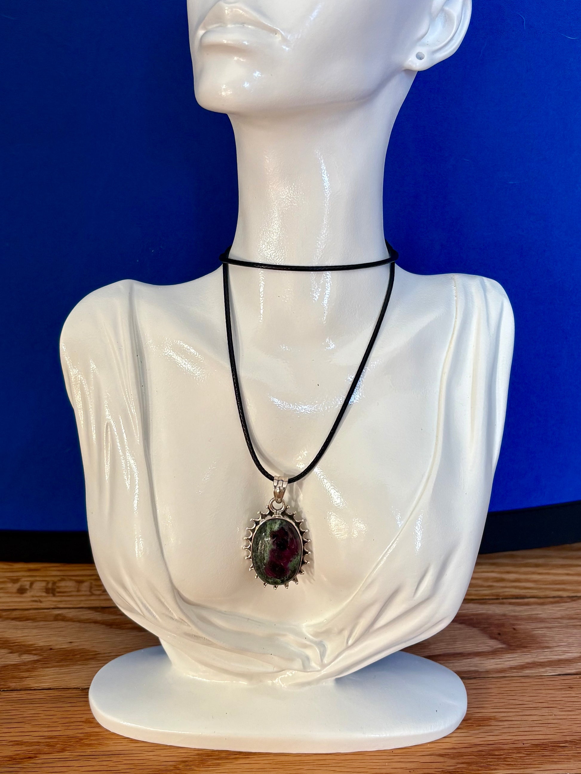 Sterling silver Ruby in Zoisite pendant on black leather cord, featuring green and ruby-toned natural stone with decorative silver edge