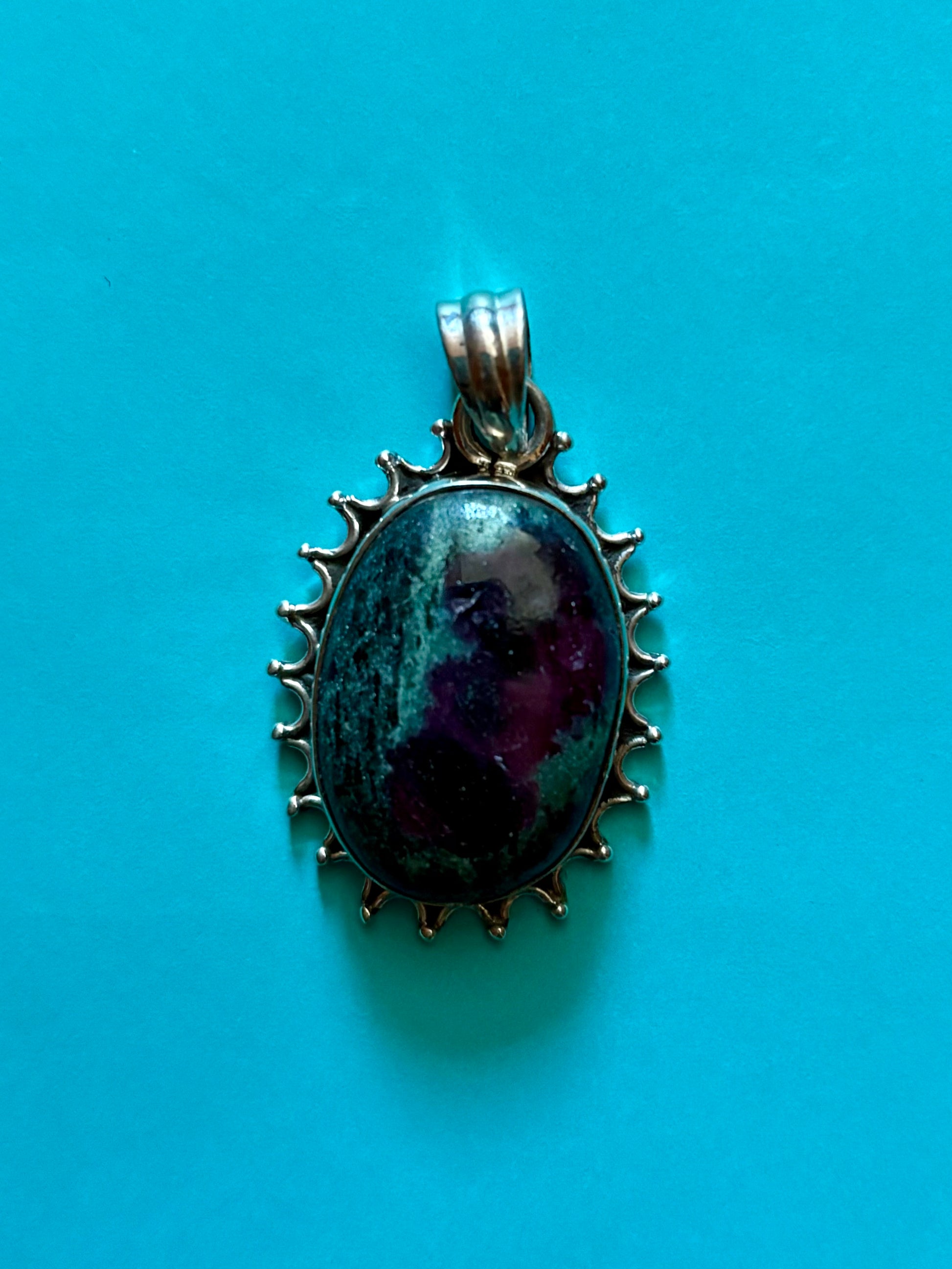 Sterling silver Ruby in Zoisite pendant on black leather cord, featuring green and ruby-toned natural stone with decorative silver edge