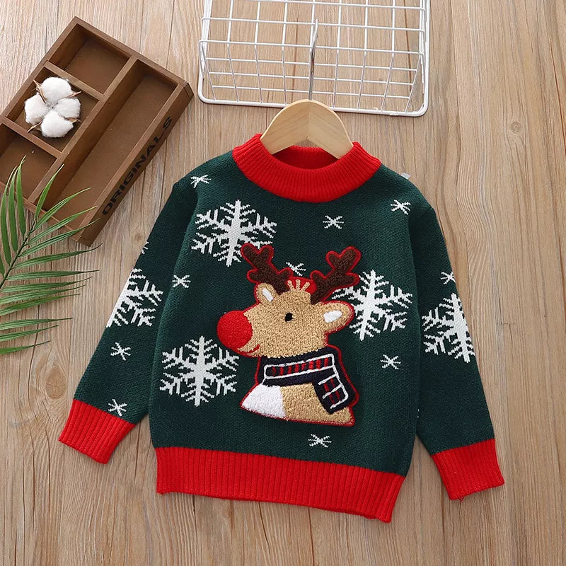 Kids’ green reindeer Christmas sweater with red trim and white snowflakes.