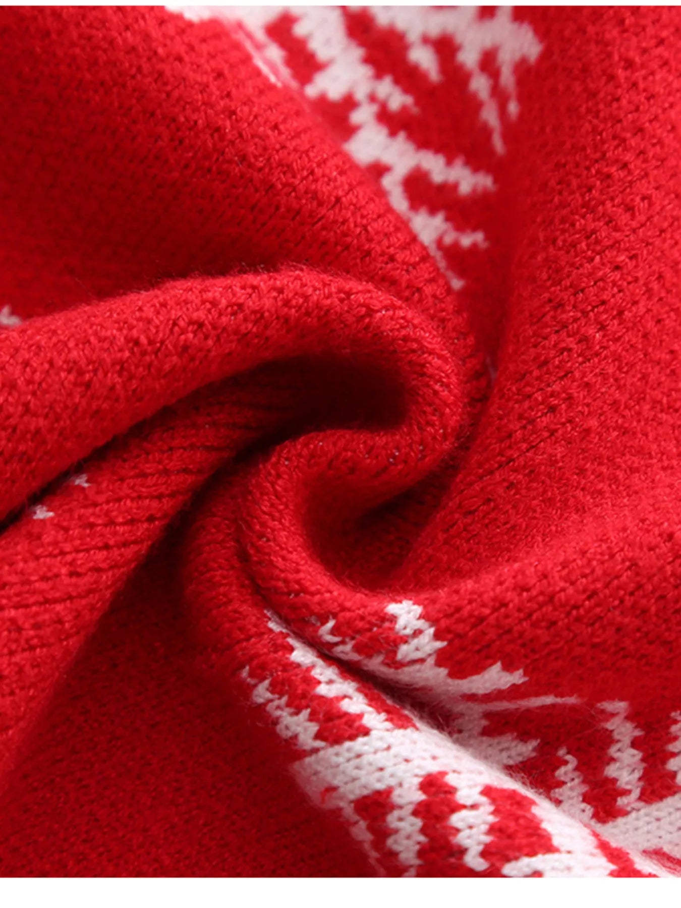 Kids’ red reindeer Christmas sweater with green trim and white snowflakes.