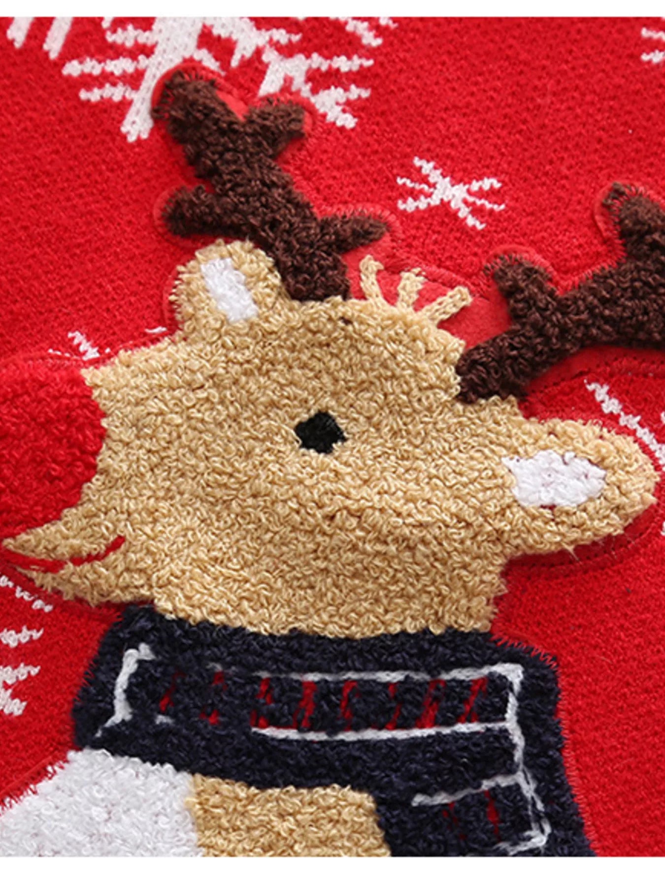 Kids’ red reindeer Christmas sweater with green trim and white snowflakes.