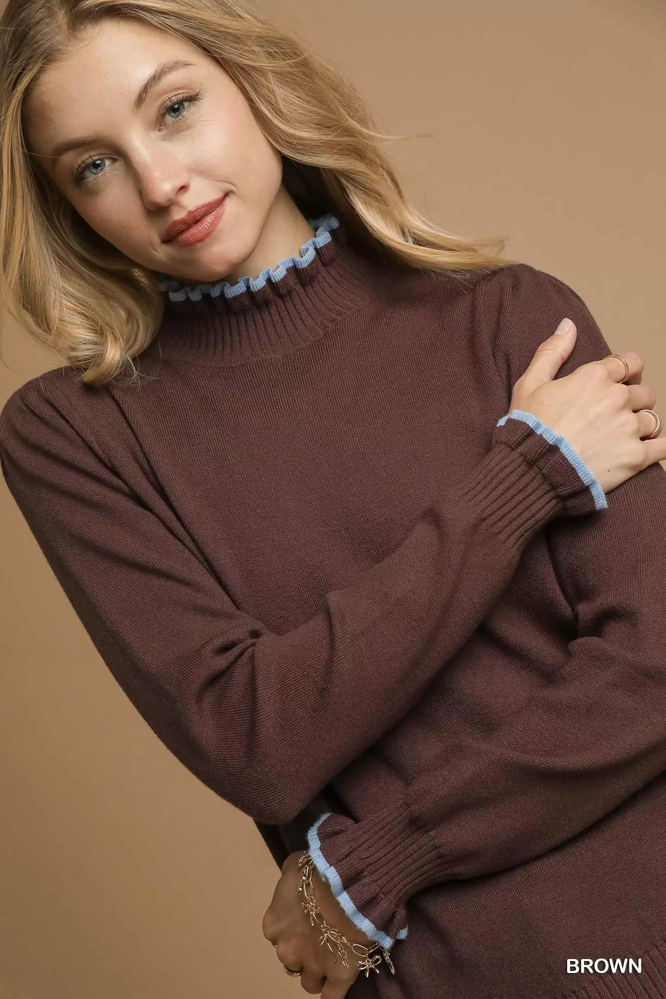Ruffle Charm Sweater – ribbed knit sweater with feminine ruffle contrast trim, chic cozy winter fashion.