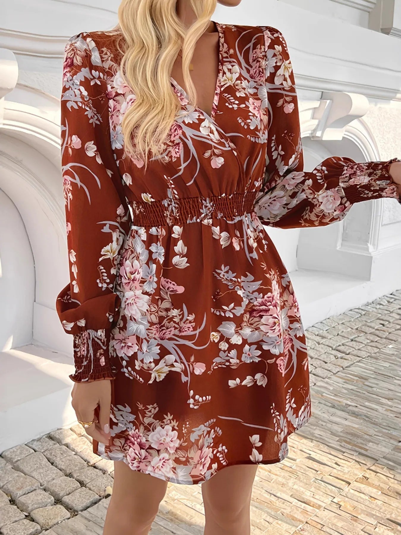 Rustic Rose Smocked Mini Dress in rust with floral print and smocked waist.