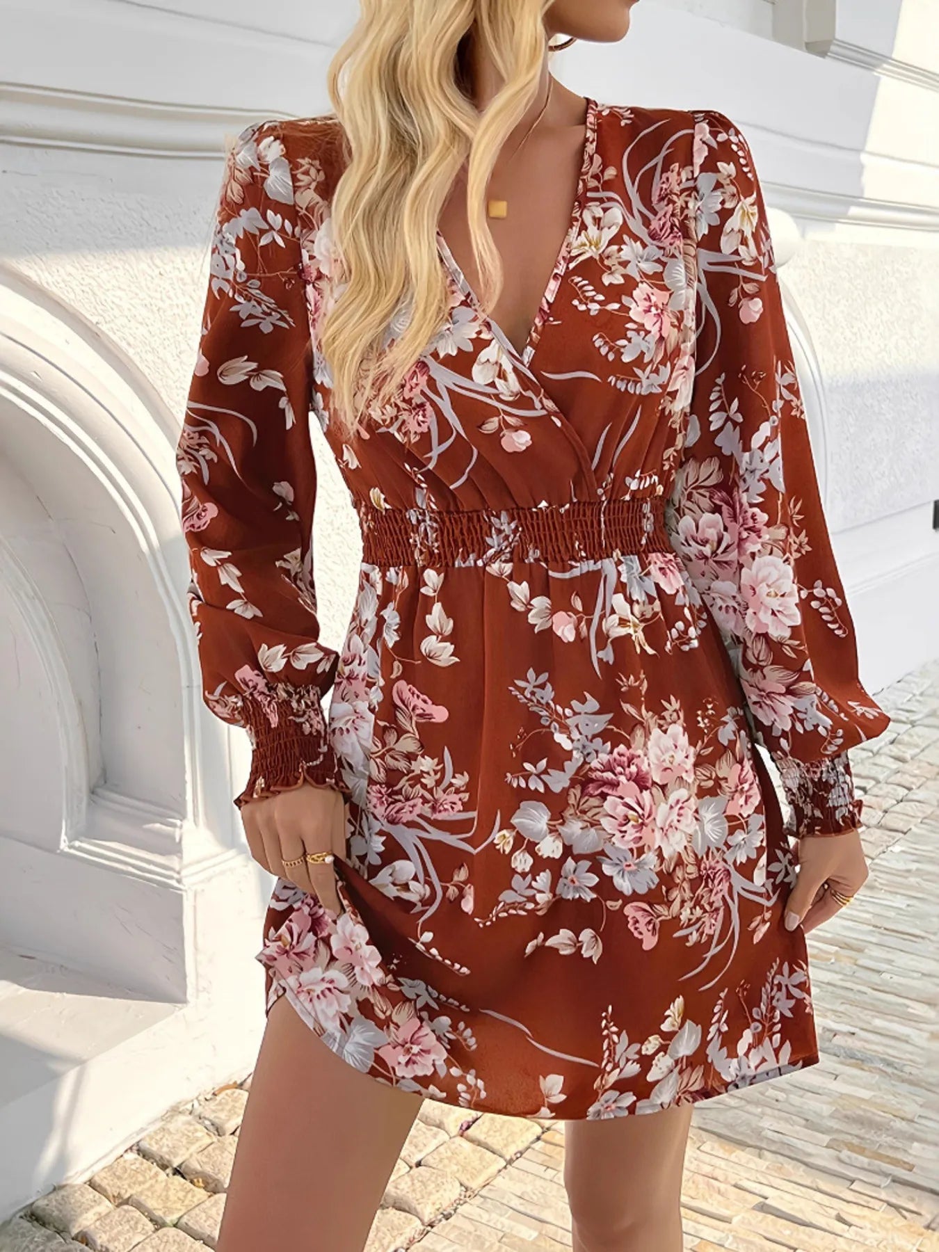 Rustic Rose Smocked Mini Dress in rust with floral print and smocked waist.