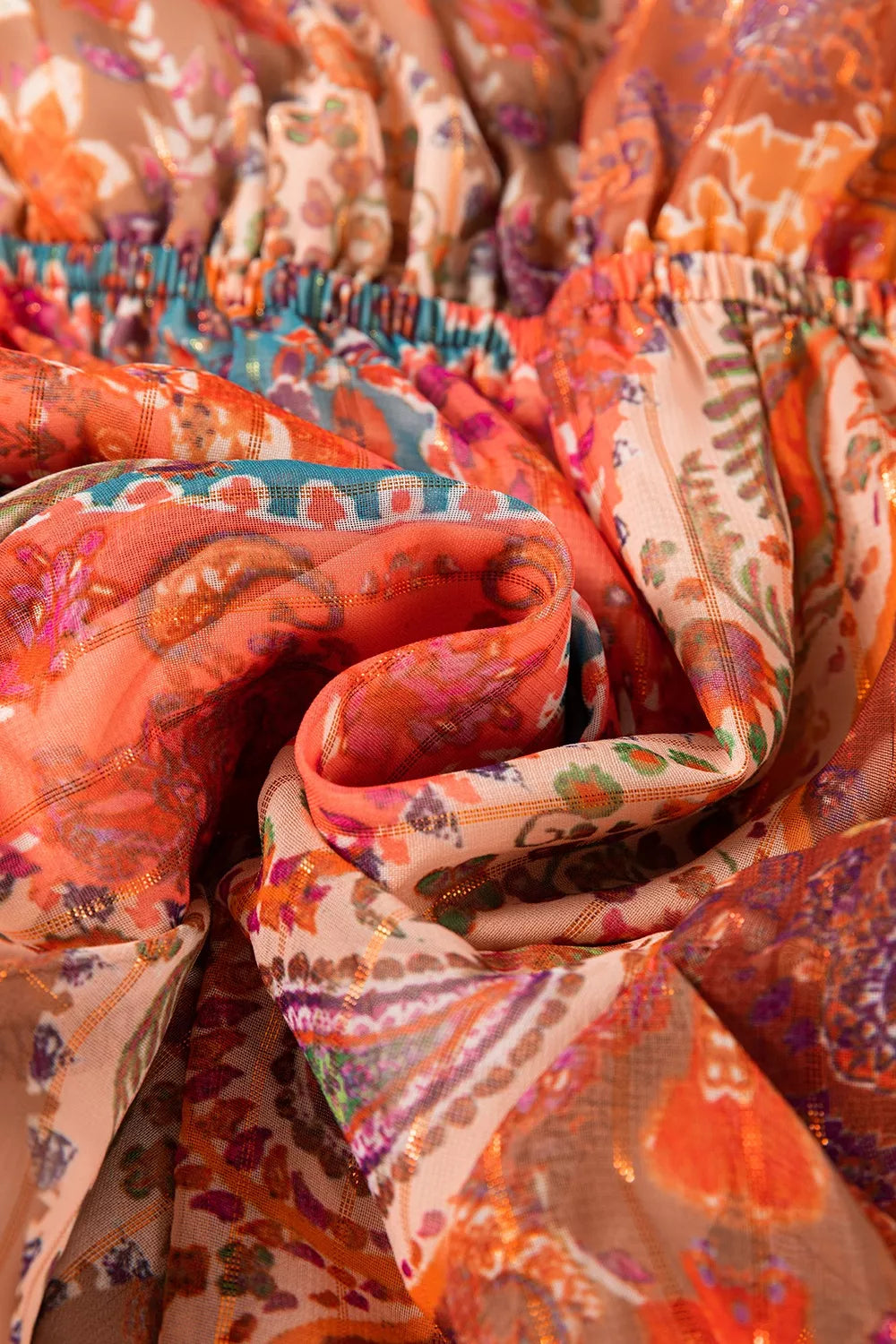 Boho paisley wrap mini dress in rust and sage tones with long sleeves and tie waist
