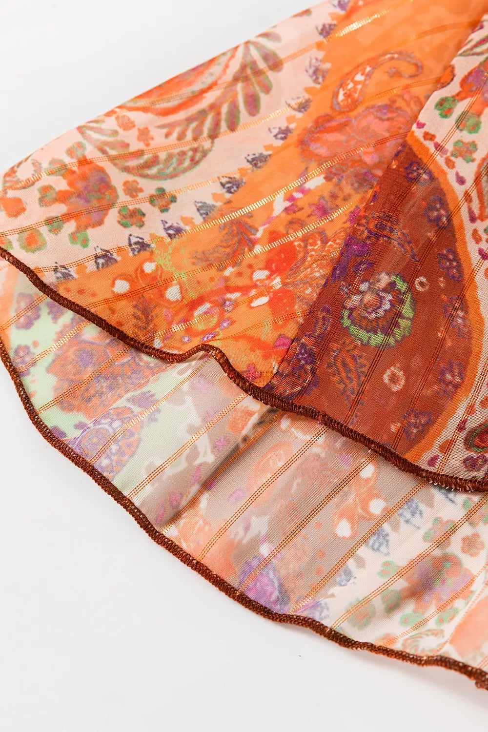 Boho paisley wrap mini dress in rust and sage tones with long sleeves and tie waist