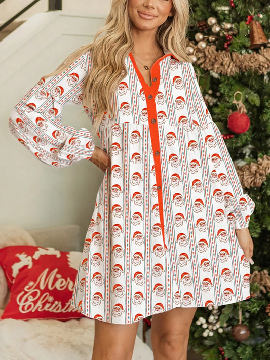 White swing dress with vertical Santa print stripes and red button placket, worn beside a decorated Christmas tree.