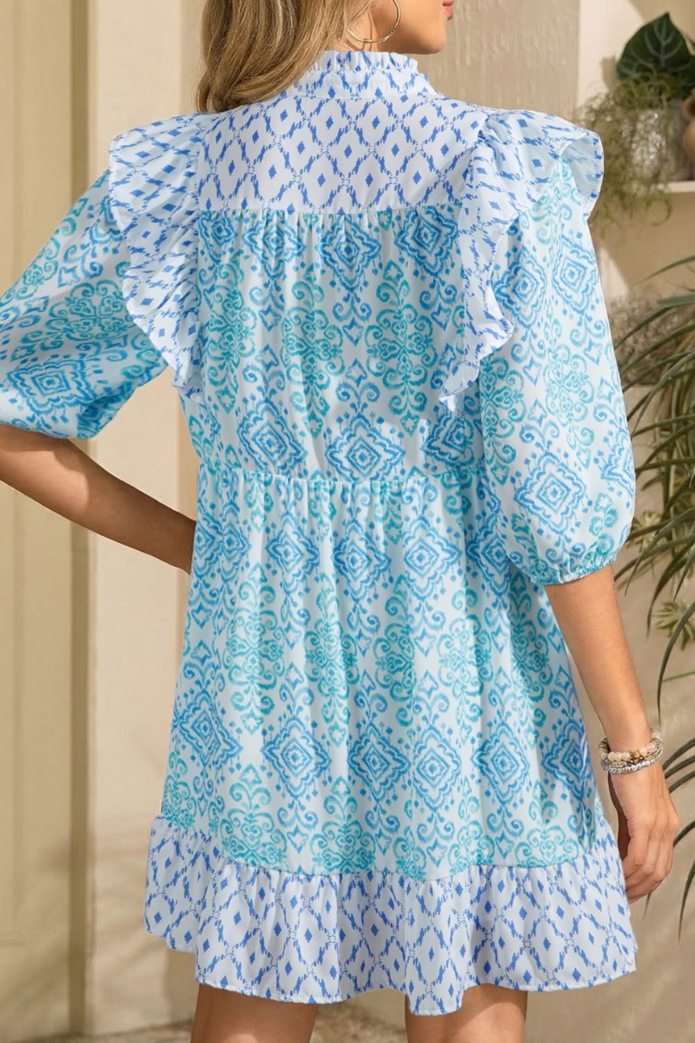 Blue printed mini dress with ruffle shoulders and puff sleeves