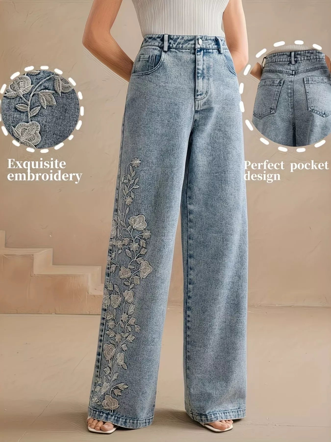 Wide-leg jeans with floral embroidery down one leg, seam detailing, structured cotton-blend denim, and a relaxed statement fit.