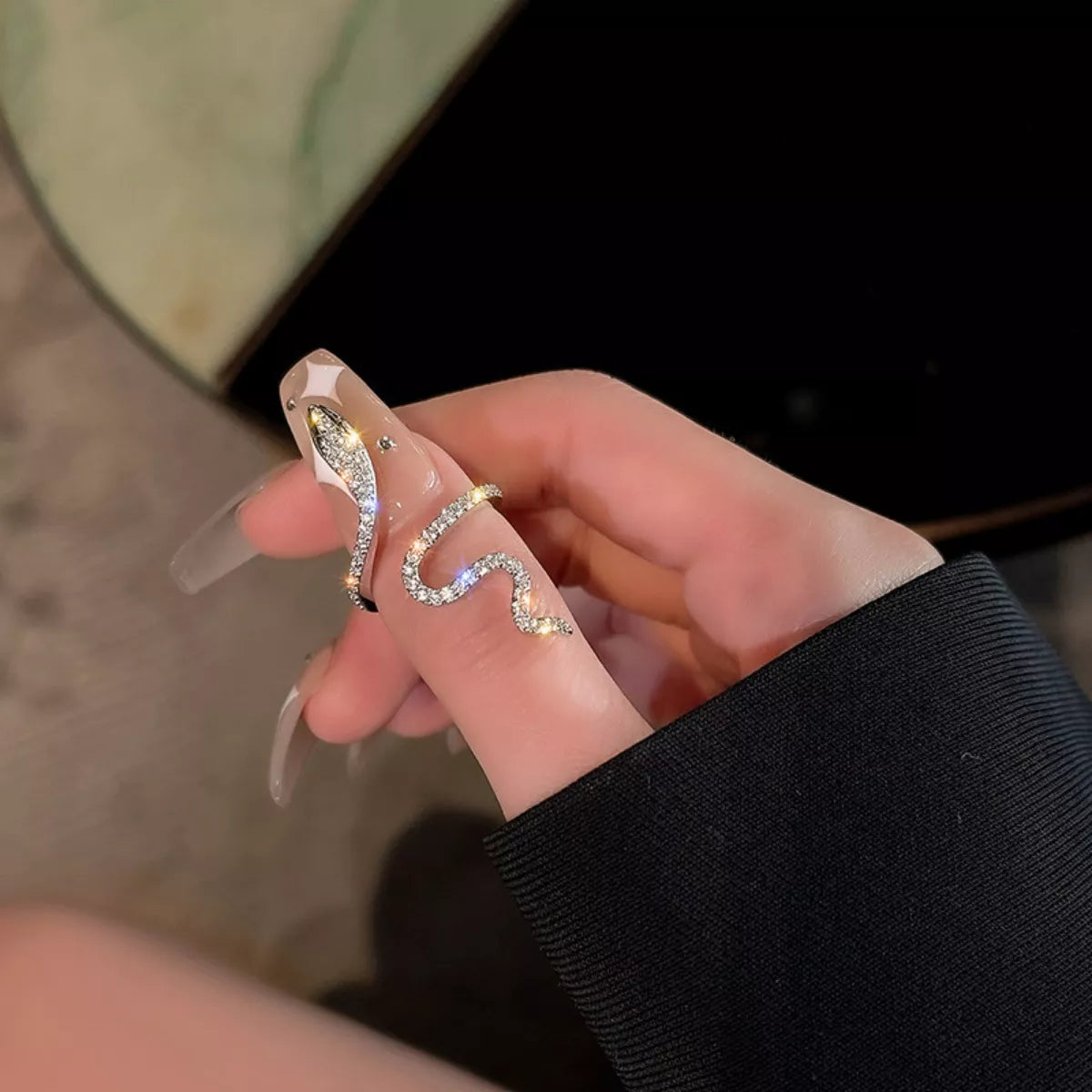 Adjustable silver snake wrap ring with sparkling zircon stones