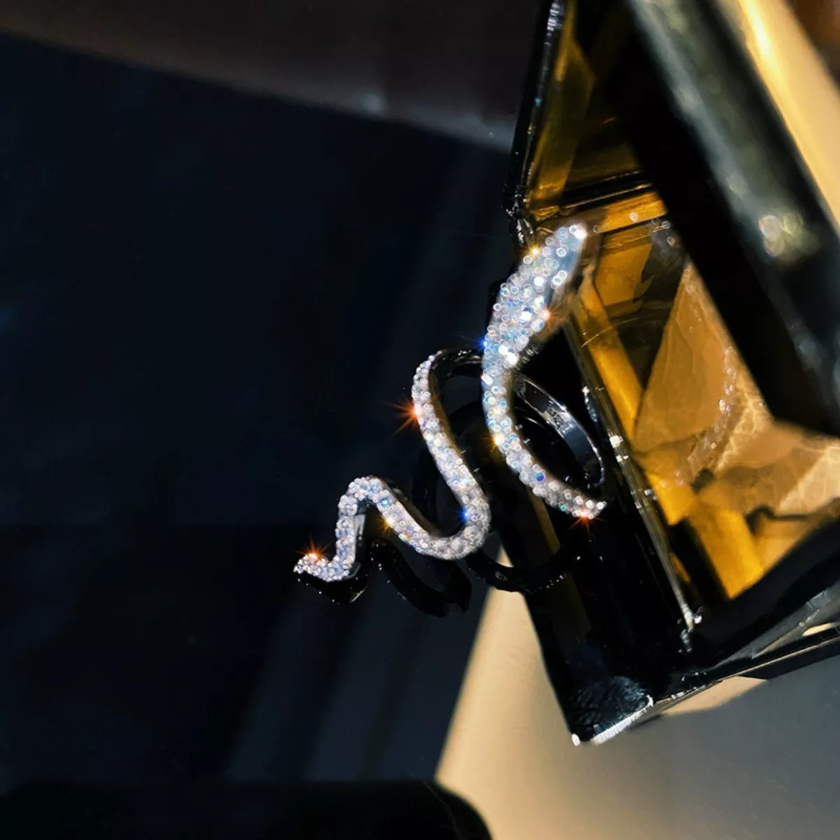Adjustable silver snake wrap ring with sparkling zircon stones