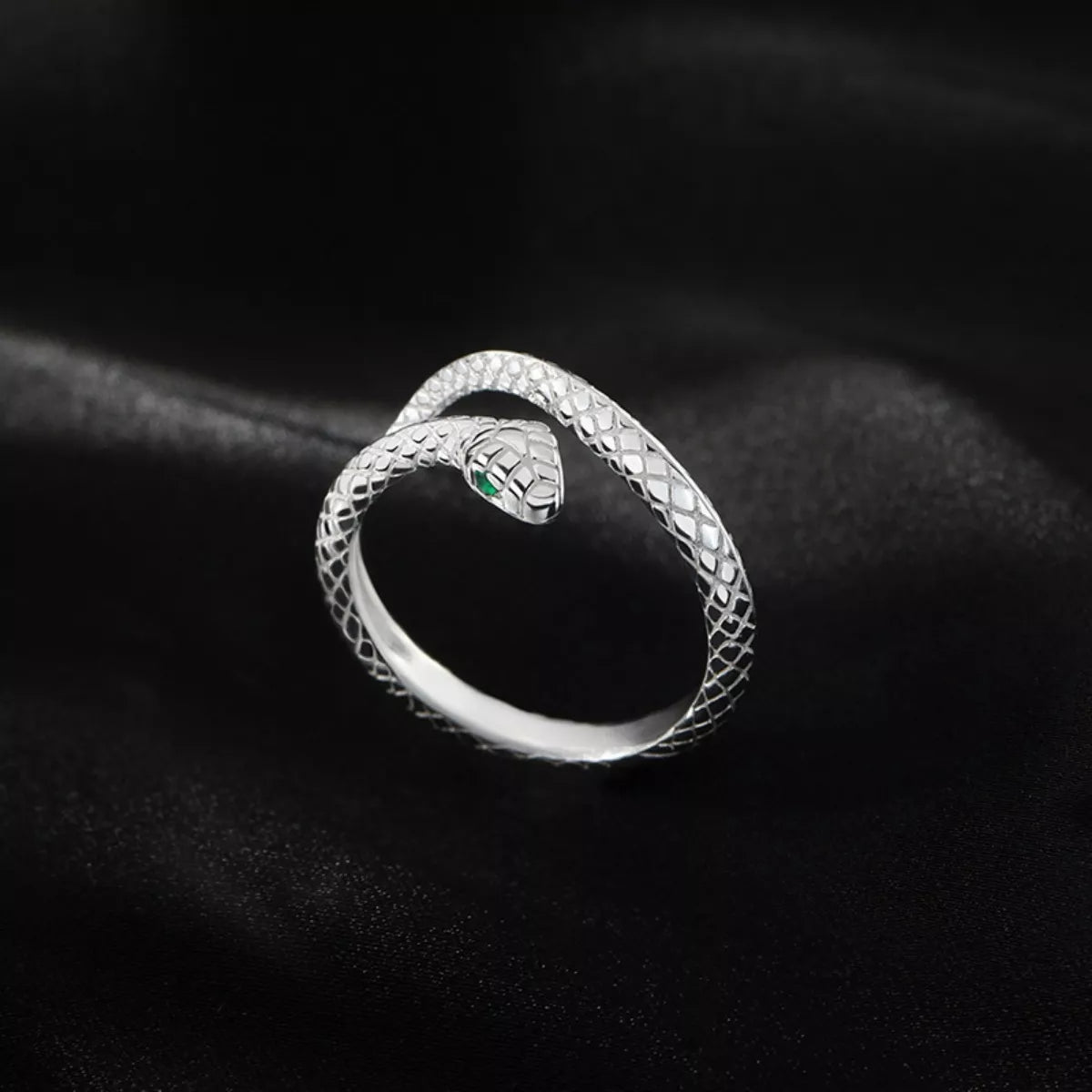adjustable sterling silver snake wrap ring with textured serpent design worn on finger