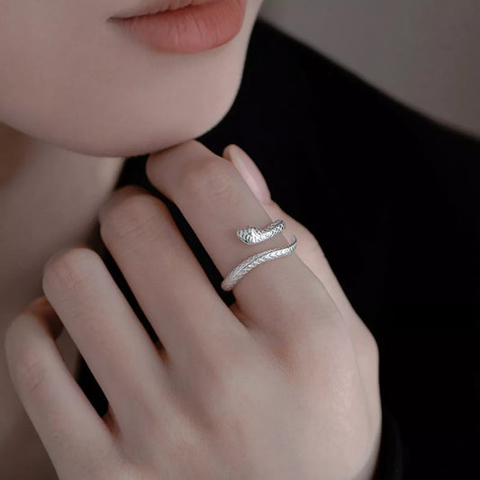 adjustable sterling silver snake wrap ring with textured serpent design worn on finger