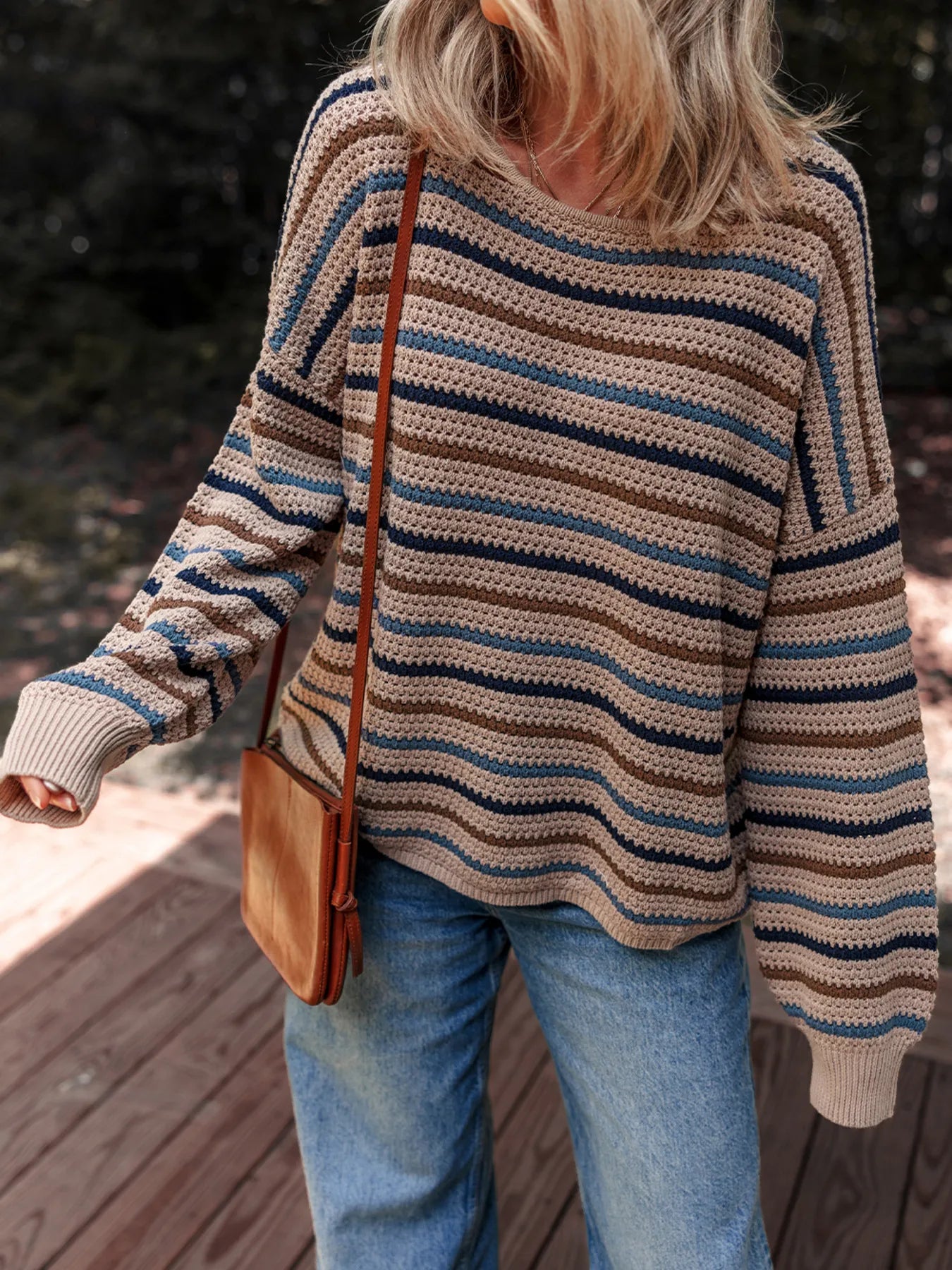 Brown and blue striped knit sweater with relaxed fit and cozy long sleeves