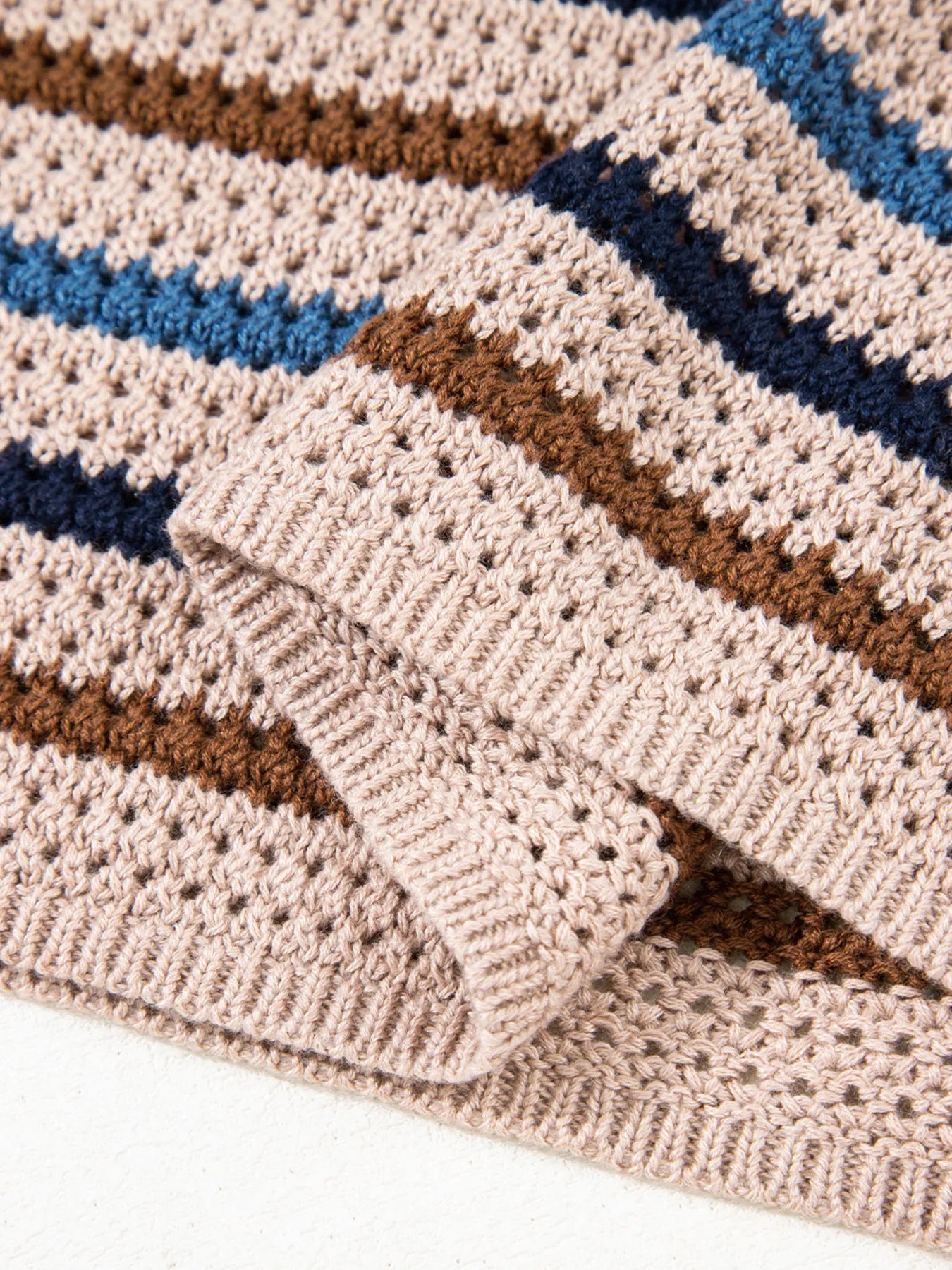 Brown and blue striped knit sweater with relaxed fit and cozy long sleeves