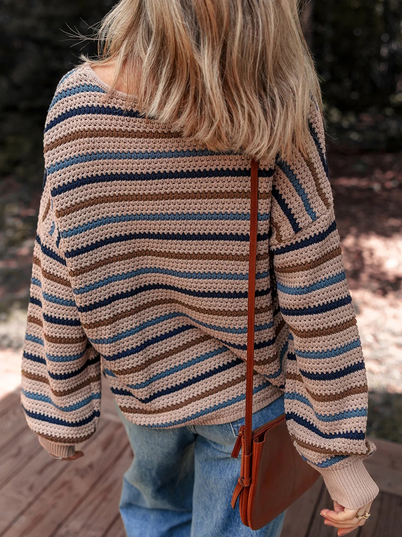 Brown and blue striped knit sweater with relaxed fit and cozy long sleeves