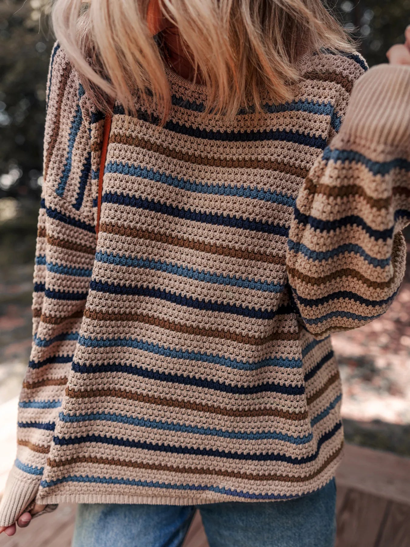 Brown and blue striped knit sweater with relaxed fit and cozy long sleeves
