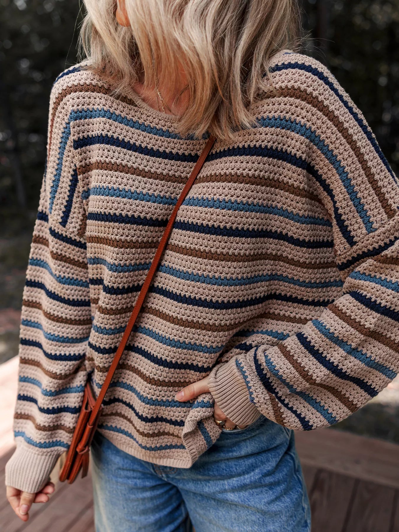 Brown and blue striped knit sweater with relaxed fit and cozy long sleeves